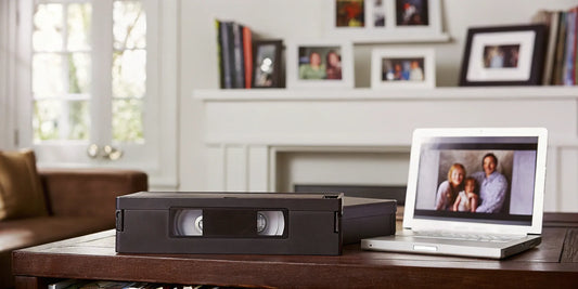 Converting an 8mm video tape to a digital file on a laptop.