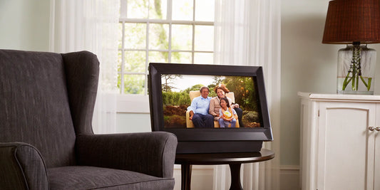 A calibrated monitor displays a family photo with vivid, true-to-life color.