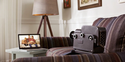 A camcorder and laptop setup for converting an old video tape to digital.