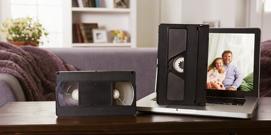 Converting VHS tapes to digital files on a laptop.