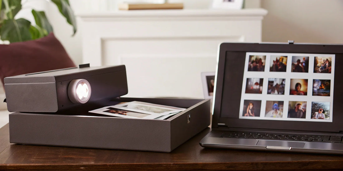 Photo slides converting to digital images on a laptop.