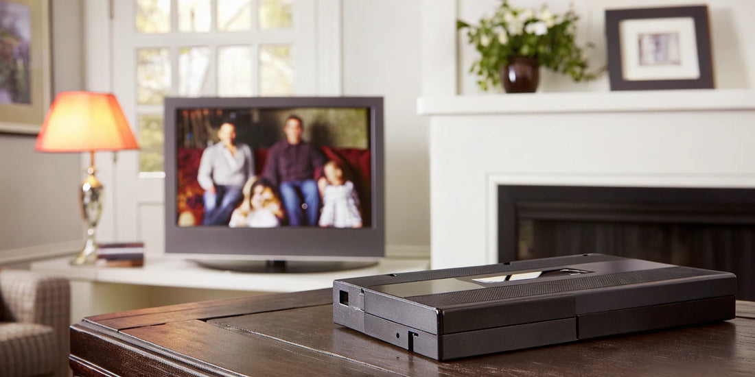 A stack of VHS tapes on a table, ready to be copied to digital.