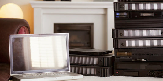 Video noise reduction for old VHS tapes using a laptop to fix grainy footage.