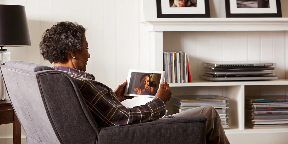 An older adult enjoys a family video call, a memory kept safe with the 3-2-1 backup rule.