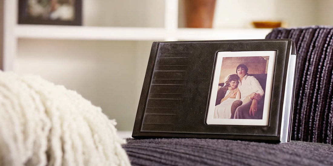 Photo album with printed pictures, preserving memories once stored on an xD-Picture card.