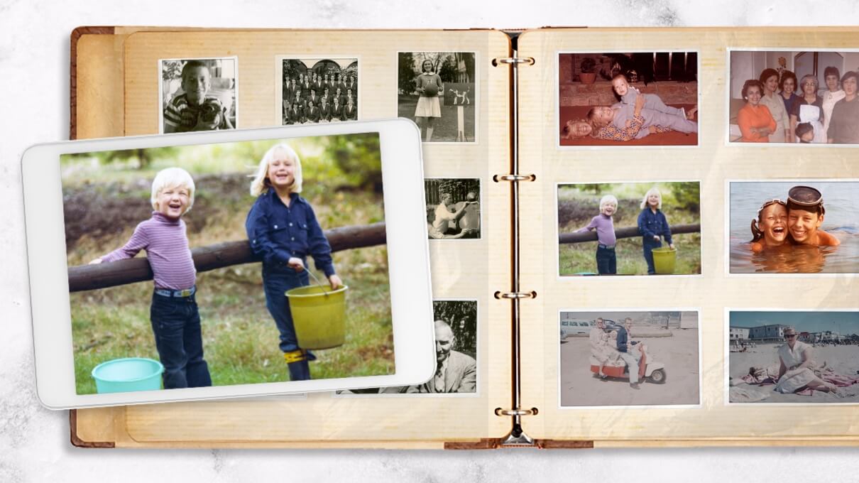 Open binder-style photo album showing vintage family prints